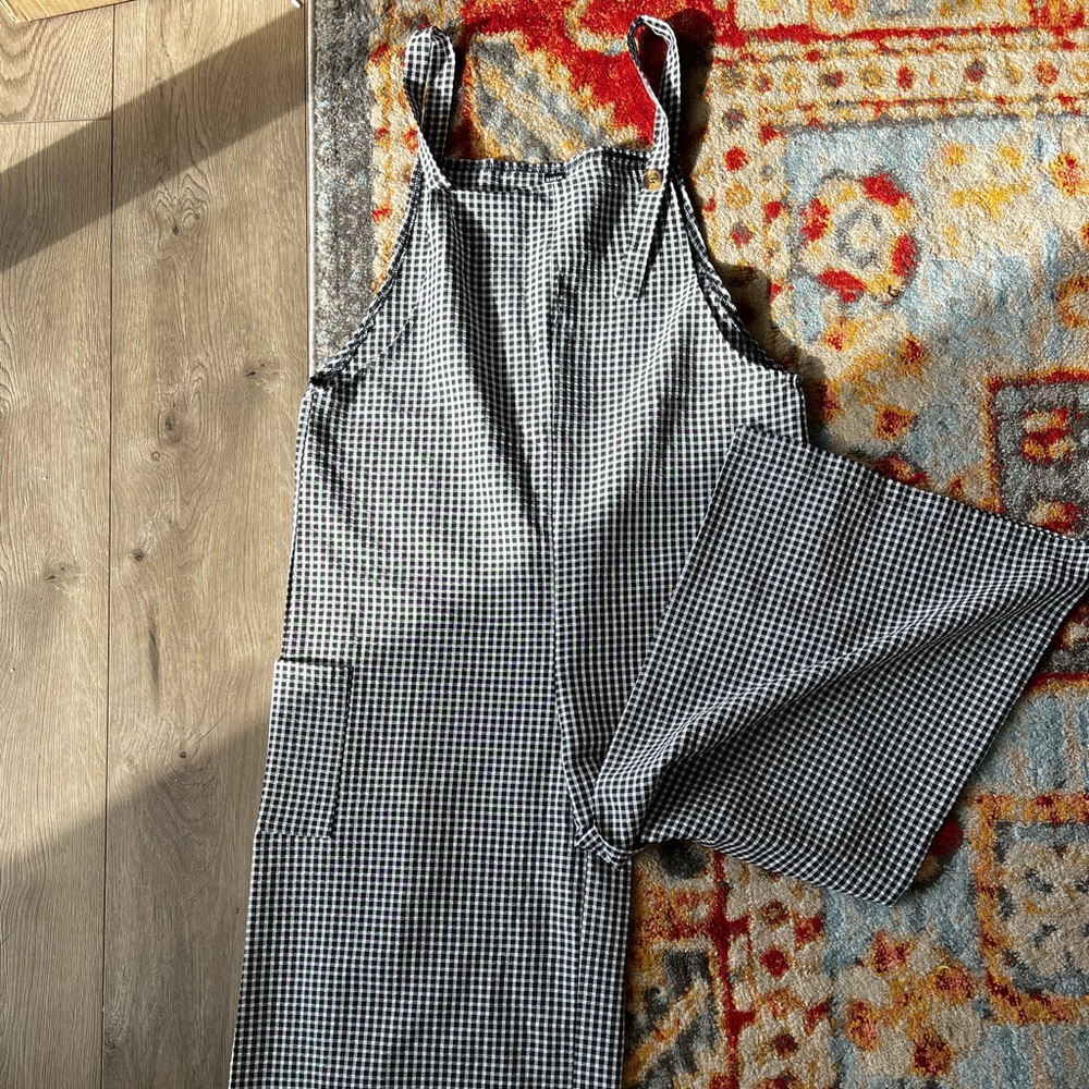 Black and white checkered overalls with wide leg bottoms